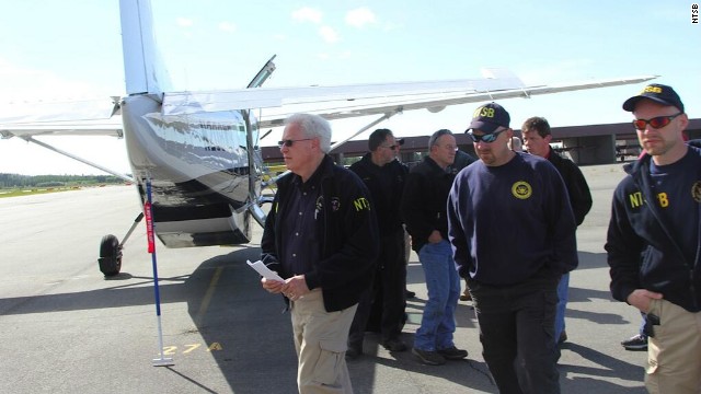 The NTSB released images from the crash site and early details via Twitter on Tuesday, July 9. Here, NTSB member Earl F. Weener and investigators arrive at the scene. 