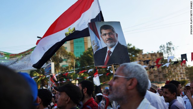 Supporters of ousted president Mohamed Morsy attend a rally before breaking the daily fast on the second day of Ramadan, the sacred holy month for Muslims, on Thursday, July 11, in Cairo. The military said it would address the issues of this week's deadly violence, making it unclear whether the religious observance would calm or inflame tensions a week after the military coup. <a href='http://www.cnn.com/2013/06/29/middleeast/gallery/egypt-protest/index.html'>See photos of protests that have engulfed the country.</a>