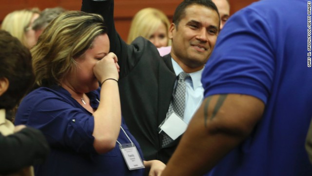 George Zimmerman's wife, Shellie Zimmerman, cries as friends and family members celebrate the verdict on July 13. 