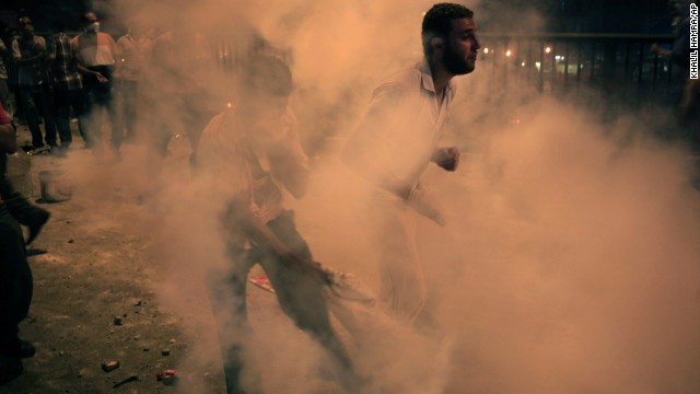 Morsy supporters run from tear gas in Cairo on July 15.