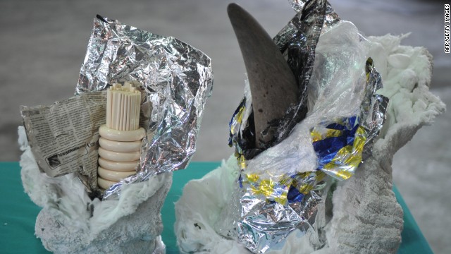 A rhino horn and ivory chopsticks and bracelets are all on display at Hong Kong's Customs and Excise Department offices on November 15, 2011, after authorities seized a container shipped from South Africa. 
