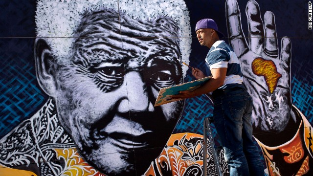 South African artist John Adams works on a giant painting of Nelson Mandela in a suburb of Johannesburg, South Africa. Mandela, an anti-apartheid icon and Nobel peace laureate, turns 95 on Thursday, July 18. He has been hospitalized since June 8 for a recurring lung infection -- a legacy of the 27 years he endured in prison before becoming South Africa's first democratically elected president. Click through the gallery for other artistic tributes to "the world's most famous political prisoner."