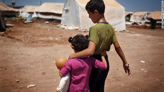 Syrian refugee children walk in the Bab al-Salam refugee camp in Syria's northern city of Azaz on Monday, July 15.