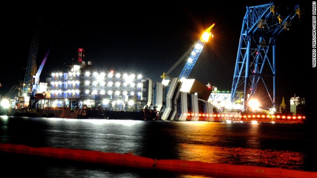 Salvage workers continue recovery operations at the site on June 15, 2013. Thirty-two people died in the tragedy and another 150 people were injured in the evacuation of the ship -- 65 of them seriously. 