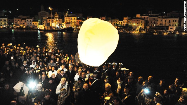 Survivors, grieving relatives and locals release lanterns into the sky in Giglio after a minute of silence on January 13, 2013, marking the one-year anniversary of the shipwreck. The 32 lanterns -- one for each of the victims -- were released at 9:45 p.m. local time, the moment of impact.