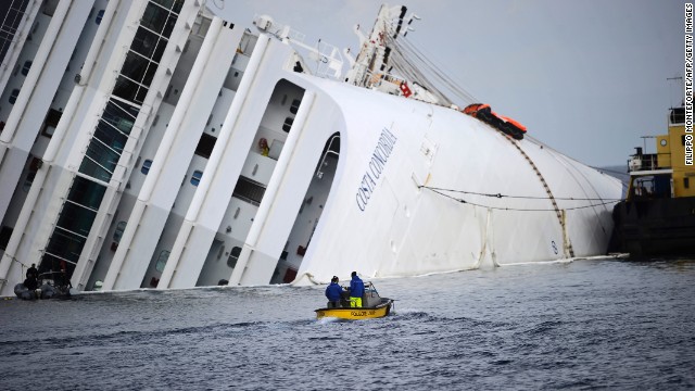 Workers head toward the stricken cruise ship on January 23, 2013.