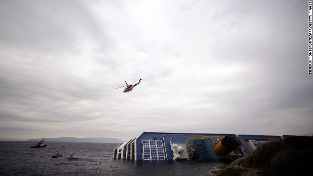 Rescuers search the waters near the stricken ship on January 16, 2012.