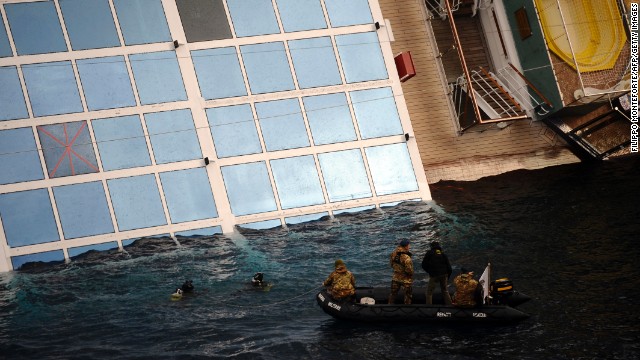 Divers inspect the Costa Concordia on January 15, 2012.