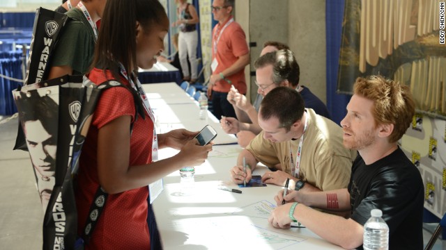 Actor, comedian and screenwriter Seth Green speaks with a fan at the "Robot Chicken" signing on July 18.