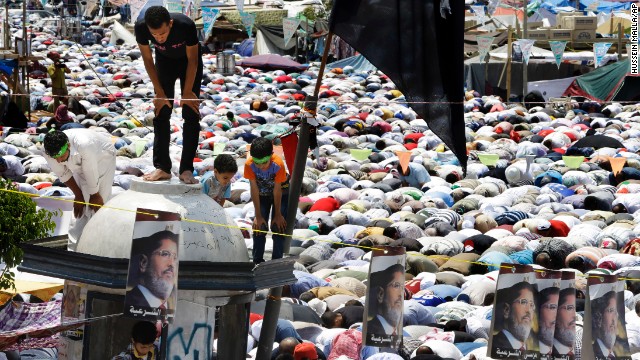 Supporters of Morsy pause for Friday prayers on July 19 at Nasr City in Cairo, where protesters have installed their camp and held daily rallies.