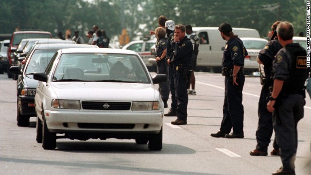 Mark Barton walked into two Atlanta trading firms on July 29, 1999, and fired shots, leaving nine dead and 13 wounded, police say. Hours later police found Barton at a gas station in Acworth, Georgia, where he pulled a gun and killed himself. The day before Barton had bludgeoned his wife and his two children in their Stockbridge, Georgia, apartment, police say. The children's birth mother and grandmother had been murdered six years earlier in Alabama. Barton was questioned but never charged in that crime.