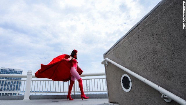 Gillian Owen, dressed as fictional comic book character Scarlet Witch, poses on a walkway during a photo shoot with another photographer on Day 4 of Comic-Con on July 20. 