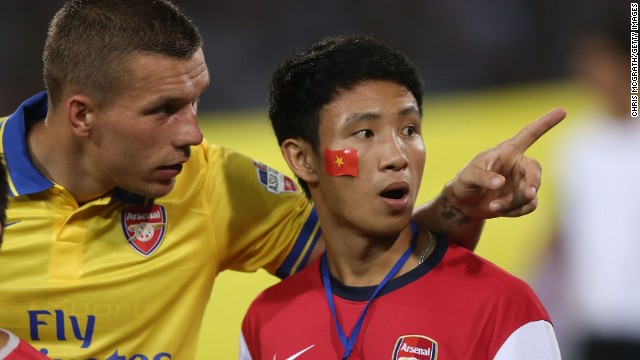 Vu Xuan Tien became Arsenal's unofficial mascot on the Hanoi leg of their pre-season Asia tour after he ran alongside the team's coach for several miles. Tien was then invited to lead the Arsenal players onto the pitch at the My Dinh stadium in Hanoi before their match against the Vietnamese national team, which they won 7-1.