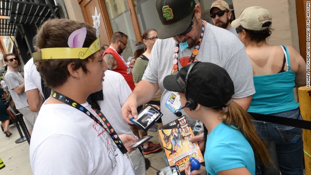 Attendees gather outside the Samsung Galaxy Experience on the final day of Comic-Con International in San Diego on Sunday, July 21. The convention is the largest comics and entertainment convention in North America and hosts celebrity panels, artist workshops, television and movie premieres as well as a trade show with booths from a variety of entertainment genres. <a href='http://www.cnn.com/2013/07/19/us/gallery/comic-con-celebs-2013/index.html' target='_blank'>See coverage of celebrity appearances at Comic-Con 2013</a>.