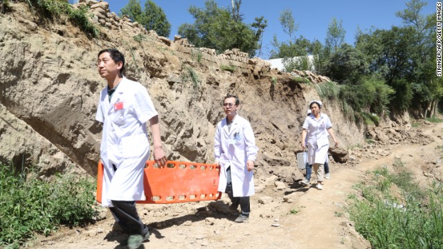 Rescuers arrive at Lalu village in Minxian on July 22.