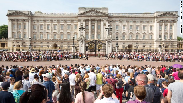Crowds gather outside Buckingham Palace in London as news of Catherine, Duchess of Cambridge's, labor arrives on July 22. 
