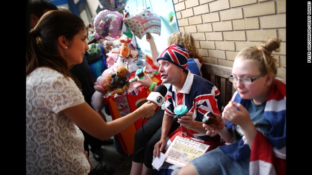 Royal supporters are interviewed by a television crew outside St. Mary's Hospital on July 22.