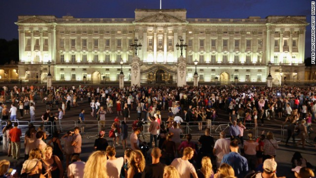 Crowds gather outside Buckingham Palace on July 22 after the announcement of the birth.