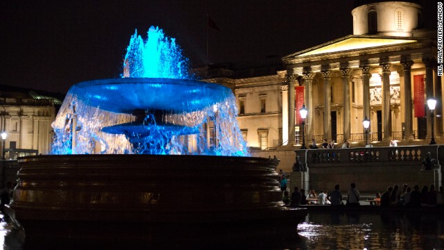 The fountains at Trafalgar Square are lit blue to signify the birth of a boy on July 22.