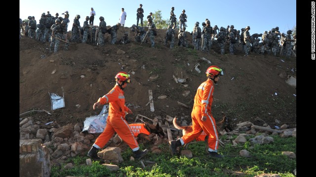 Rescuers search for victims in Yongguang on July 23.