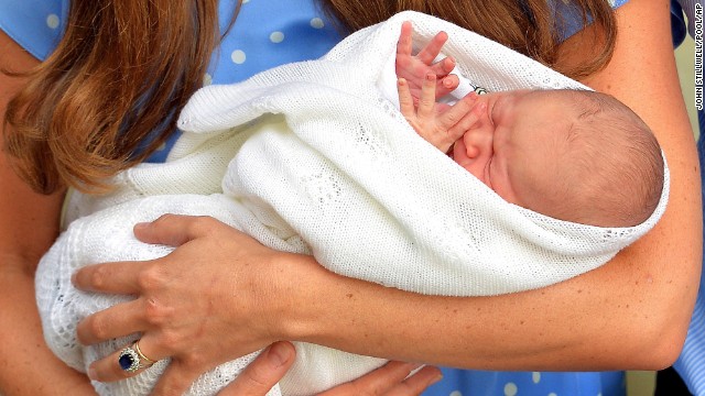 Catherine holds the baby outside the hospital for the public's first view.