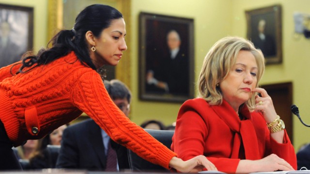 Abedin delivers a note to Clinton on March 10, 2011, during a hearing of the House State, Foreign Operations and Related Programs Subcommittee. She started as a White House intern in 1996. 