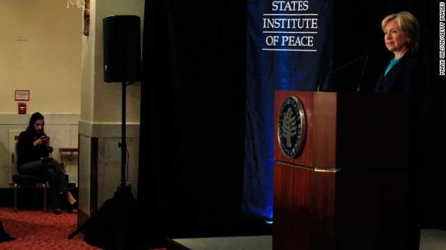 Abedin sits offstage as Clinton speaks on reinvigorating the United States' nonproliferation policy on October 21, 2009, at the Mayflower Hotel in Washington.