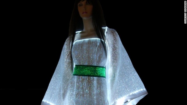 Glow in the dark with the <a href='http://www.lumigram.com/catalog/product_info.php?products_id=112' target='_blank'>LumiDress.</a> Made up of ultra-thin optical fibers woven together with other synthetic fiber this dress will light up the night. ” border=”0″ height=”360″ id=”articleGalleryPhoto0015″ style=”margin:0 auto;display:none” width=”640″/><cite style=