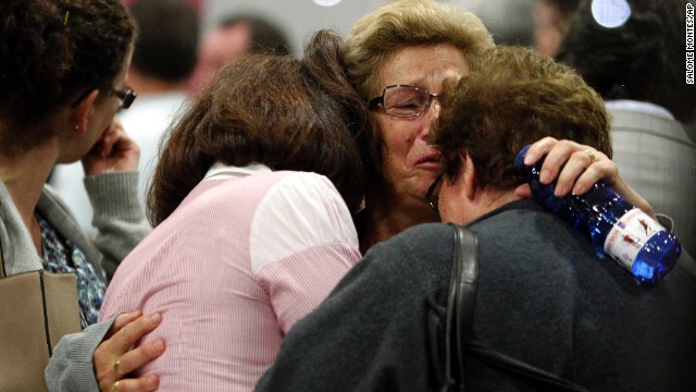 Women wait for news about crash victims in Santiago de Compostela on July 25.