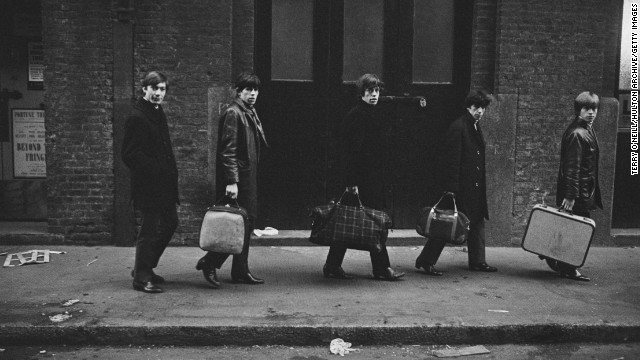 From left, Charlie Watts, Keith Richards, Mick Jagger, Bill Wyman and Brian Jones carry their bags past London's Donmar Rehearsal Theatre in 1963.