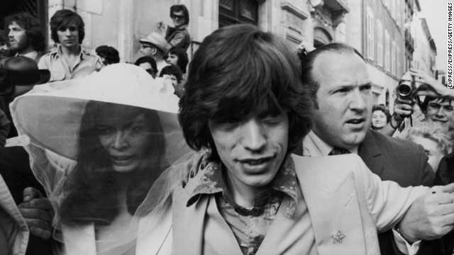 Mick Jagger and his new bride, Bianca Perez Morena de Macias, make their way through the crowds on their wedding day in 1971 in St. Tropez, France.