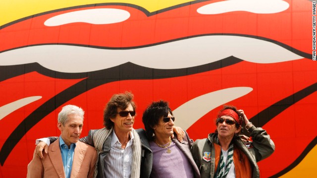 From left, Charlie Watts, Mick Jagger, Ron Wood and Keith Richards pose in front of a Rolling Stones blimp after arriving in New York in 2002.