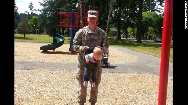 Carter plays with his daughter Sehara Carter at a park at Joint Base Lewis-McChord in Washington state in early July 2013. 