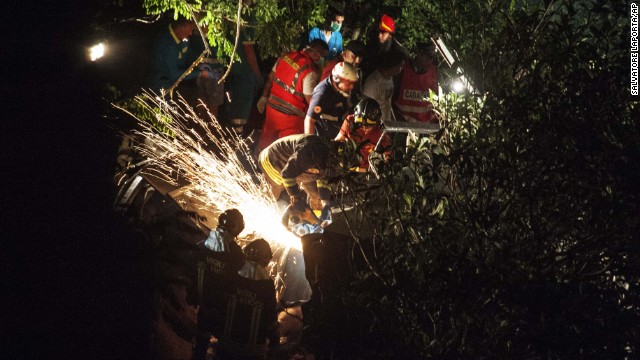 Sparks fly as firefighters cut into the wreckage. 