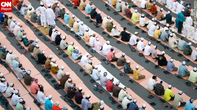 Muslim men <a href='http://ireport.cnn.com/docs/DOC-1012390'>gather for early morning prayer</a> at Hamidiya Masjid in Mumbai. "The place was noisy, but as soon as the prayers started, it was so peaceful and pin-drop [silent]," said Anupama Kinagi, who captured the geometric pattern formed by so many bowed heads and bodies.
