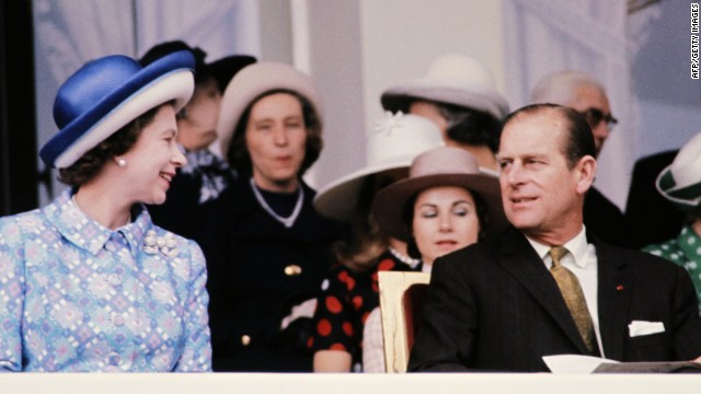 Queen Elizabeth II and her husband the Duke of Edinburgh enjoy the racing at Longchamps in Paris in 1972. 