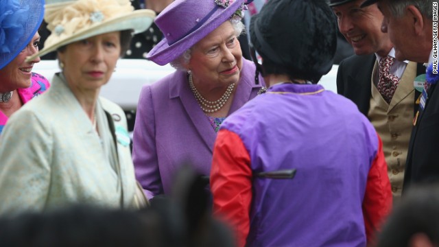 Britain's monarch shares a private moment with her connections and jockey Ryan Moore after the historic victory in June 2013. Her only daughter Princess Anne, who represented Britain at the 1976 Olympics in equestrian, is to her left. 