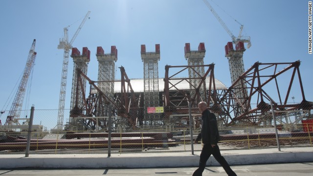 Twenty-seven years after the nuclear disaster, engineers work on April 26, 2013, to construct a colossal arch-shaped structure to permanently cover the exploded reactor.