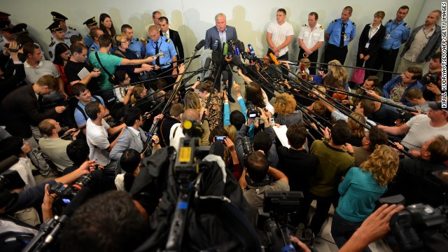 Russian lawyer Anatoly Kucherena, center, speaks with journalists at the Sheremetyevo International Airport in Moscow after meeting with Snowden on Wednesday, July 24. Kucherena said he was in daily contact with Russian authorities about securing permission for Snowden to leave the airport.