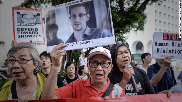 Protesters in Hong Kong shout slogans in support of Snowden on June 13. The NSA leaker vowed to fight any bid to extradite him from Hong Kong.