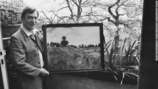 Patrick Troughton, who played the second Doctor from 1966-1969, holds one of his own paintings outside his home in Teddington, London, on May 5, 1981.