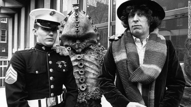 The fourth Doctor, played by Tom Baker from 1974-1981, standing alongside a Zygon, meets Sergeant Frank Ziegler, a guard at the American Embassy in Grosvenor Square, London in 1978.