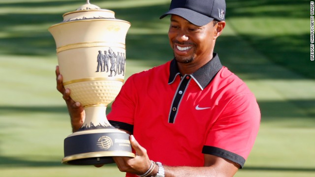 Tiger Woods holds aloft the Gary Player Cup after winning the WGC-Bridgestone Invitational in Ohio.