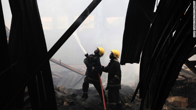 Firefighters work to put out the blaze on August 7.