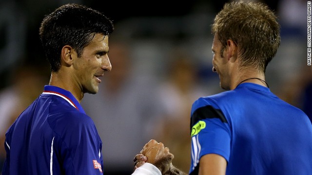 Novak Djokovic was all smiles after thumping Florian Mayer 6-2 6-1 in his first match since Wimbledon. Djokovic saved all seven break points he faced. 