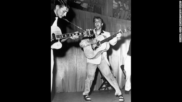 The rock 'n' roll singer performs on stage with his brand new Martin D-28 acoustic guitar at Fort Homer Hesterly Armory in Tampa, Florida, on July 31, 1955.
