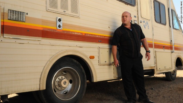 Walt's brother-in-law Hank (Dean Norris), a DEA agent, tracks down the RV that Walt and Jesse have been using as a meth lab, trapping Walt and Jesse, who are hiding inside. But Walt orchestrates a fake emergency phone call to lure Hank away and escape without being identified.