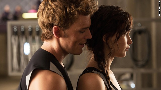 Sam Claflin, left, co-stars with Jennifer Lawrence in the 