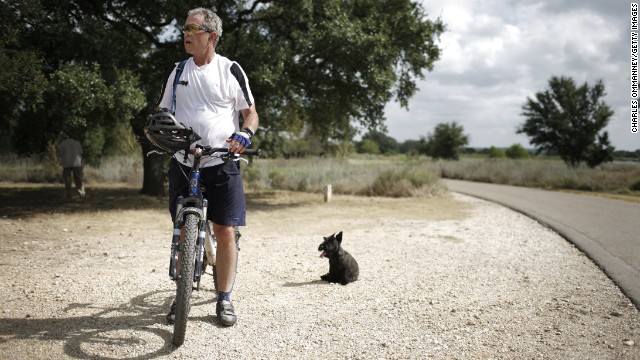 President George W. Bush bicycles at his Prairie Chapel Ranch on August 24, 2007, in Crawford, Texas. 