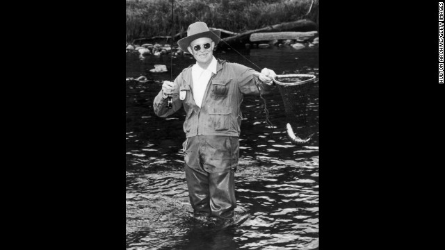 President Dwight Eisenhower fishes the North Platte River in 1953 at the Swan Hereford Ranch in Colorado. Eisenhower also enjoyed golf trips to Augusta, Georgia. 